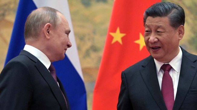 Presiden Rusia Vladimir Putin menghadiri pertemuan dengan Presiden China Xi Jinping di Beijing, China, Jumat (4/2/2022). ANTARA FOTO/Sputnik/Aleksey Druzhinin/Kremlin via REUTERS/AWW/djo (via REUTERS/SPUTNIK)